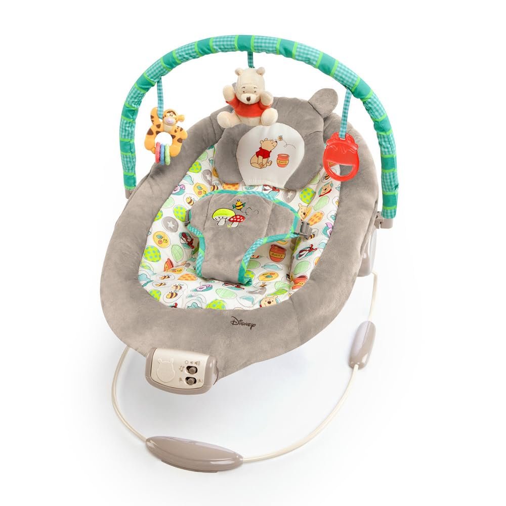 Bright Starts Disney Baby Winnie The Pooh Baby Bouncer Soothing Vibrations Deluxe Infant Seat - Faux Suede, Music, Removable -Toy Bar, 0-6 Months 6-20 lbs (Dots & Hunny Pots)
